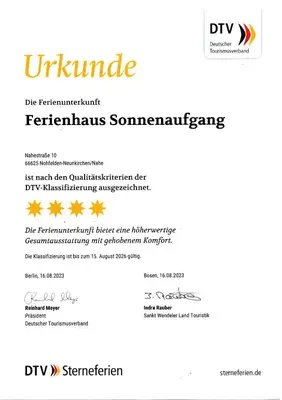 Ein Zertifikat, Auszeichnung, Logo oder anderes Dokument, das in der Unterkunft Ferienhaus Sonnenaufgang ausgestellt ist