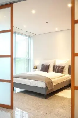Ein Bett oder Betten in einem Zimmer der Unterkunft Exklusive Stadtoase Design·Wohnung · Panoramablick