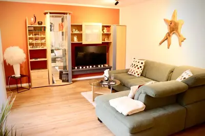 Ein Sitzbereich in der Unterkunft Ferienwohnung Osterquelle